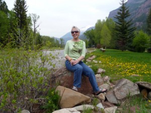 Lady posing near a river.