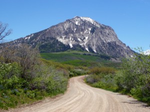 Gravel road with mountain in the background. 