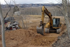Excavator tore through rock and dirt.