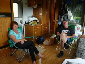 Patti and Tom Hamilton relaxing in the RV.