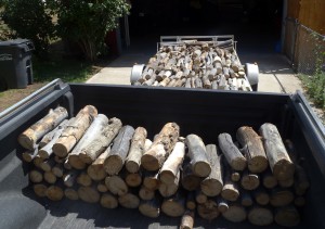 Firewood in truck and trailer waiting to be delivered