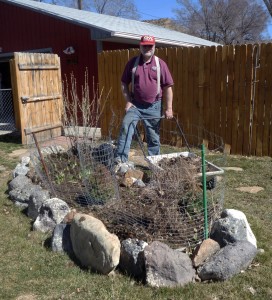 Taking mulch out of the front flower bed.( Photo by P. Fields.)