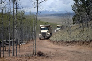 Gravel trucks, two of them, arrive with our 28 tons of gravel