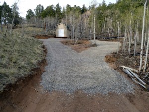 Driveway in, shed up, wood destined for burn pit ready to load