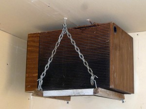 Garage speaker mounts are suspended from ceiling