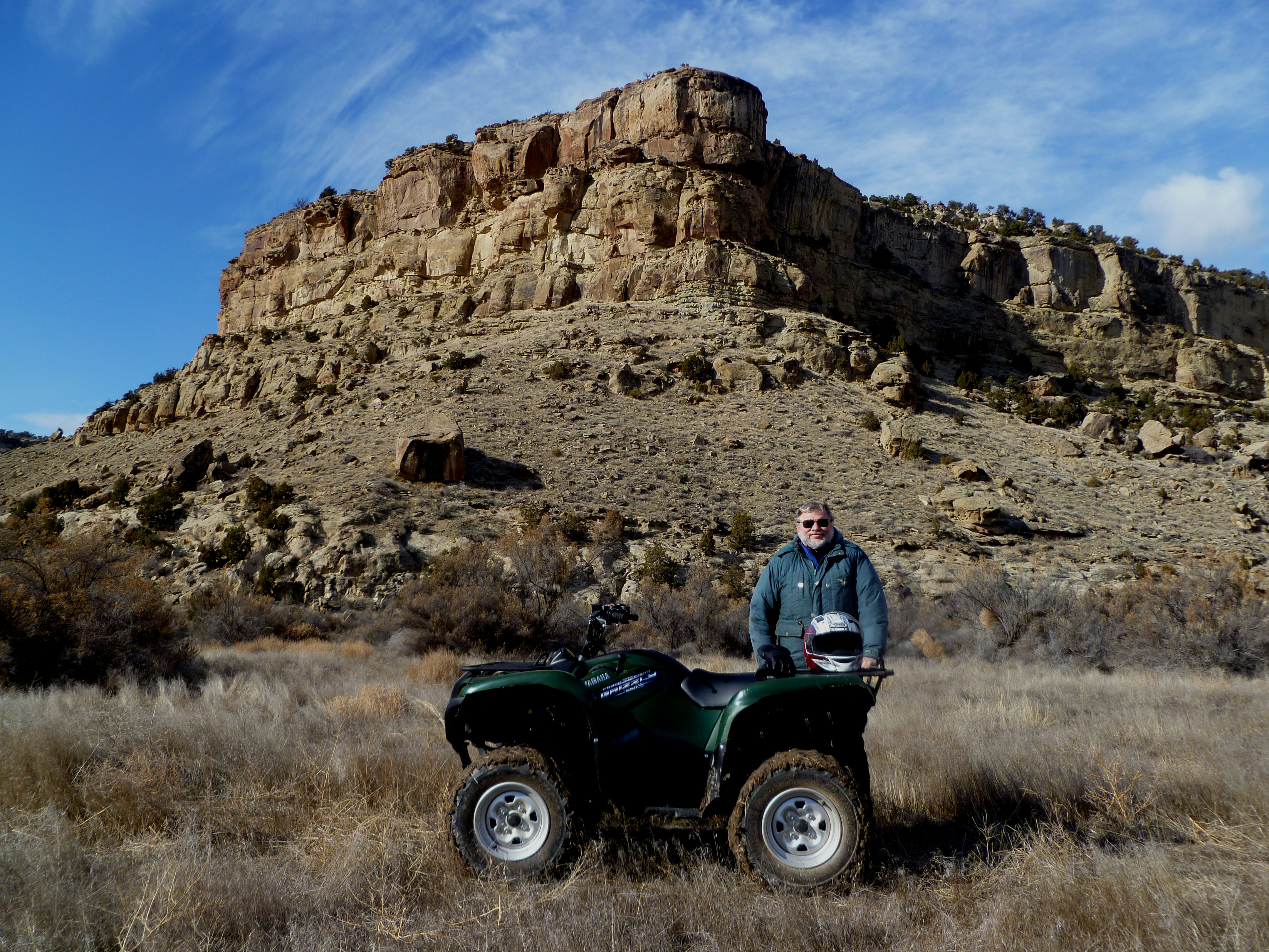 ATV in front of rock formation